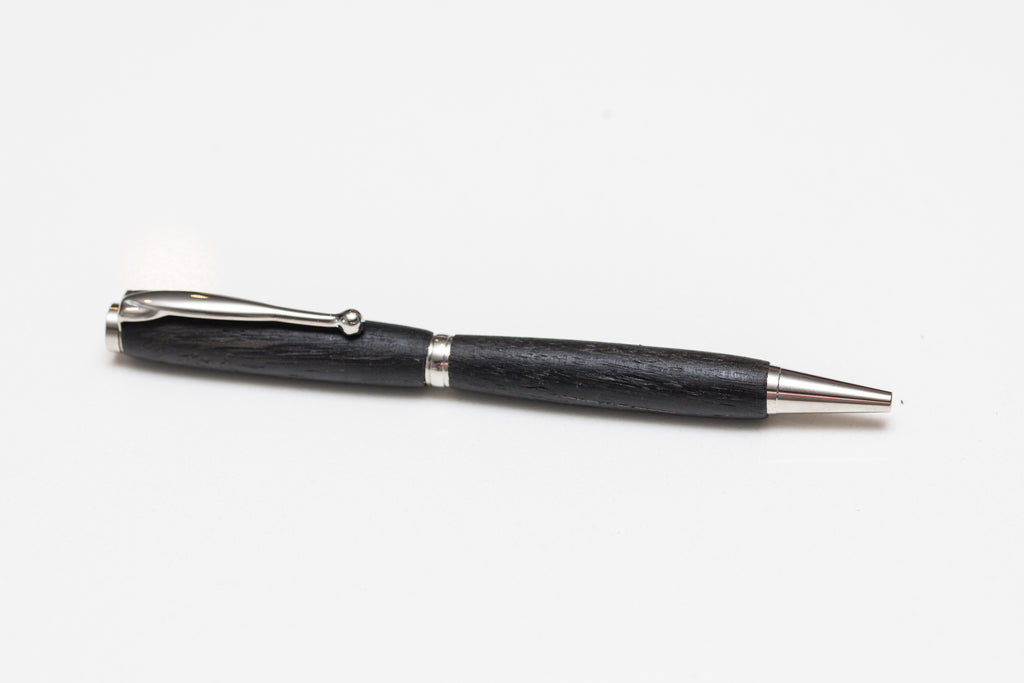 A black Irish Bog Oak wooden pen with antique rose copper fittings, displayed against a white background.