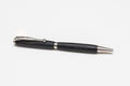 A black Irish Bog Oak wooden pen with antique rose copper fittings, displayed against a white background.