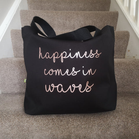 Happiness in waves tote bag